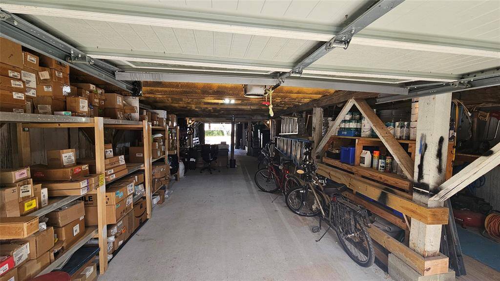 2 Remote Garage Doors, One in front and one in back of property.