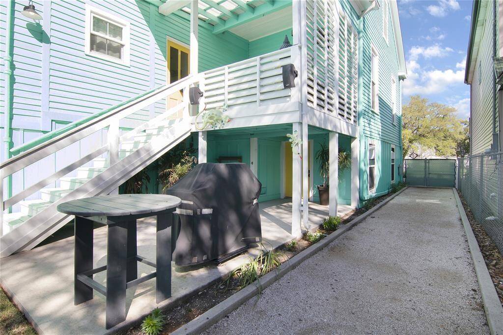 Let's step outside looking towards the patio and the balcony. To the right is the Bocce Ball Court!!