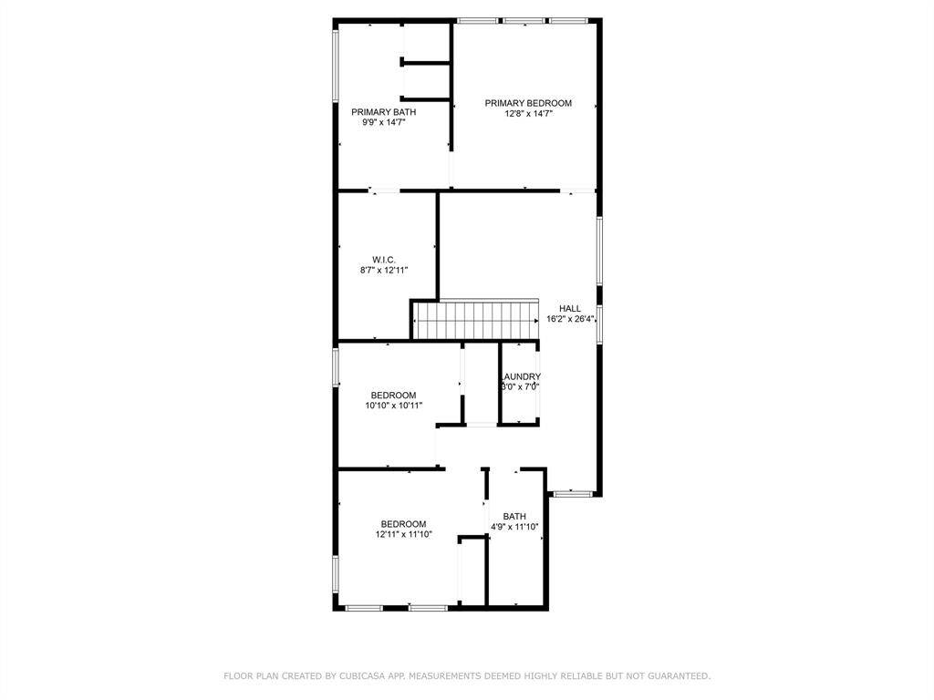 This floor plan features a primary bedroom with an attached bath and walk-in closet, two additional bedrooms, a shared bathroom, and a laundry room. The hallway provides central access to all rooms.