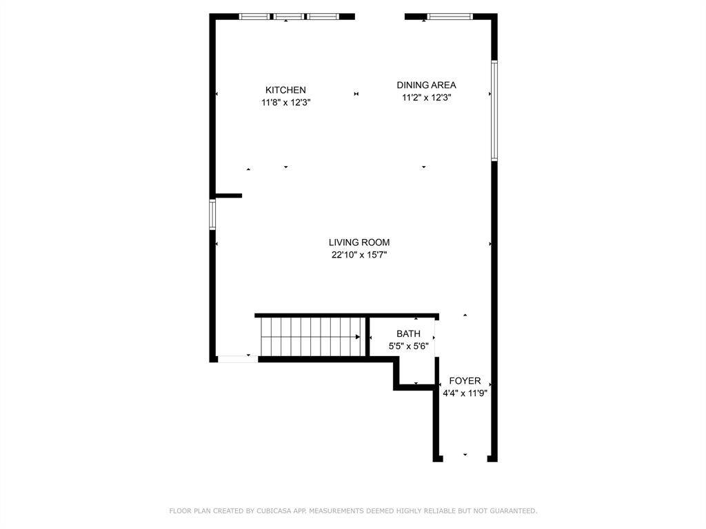 This floor plan features an open layout with a spacious living room (22'10" x 15'7"), connected to a kitchen (11'8" x 12'3") and dining area (11'2" x 12'3"). It includes a foyer (4'4" x 11'9") and a small bath (5'5" x 5'6"). Ideal for comfortable living and entertaining.