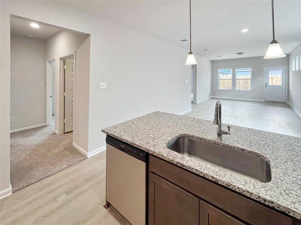 The Cardinal II- Family Room and Hall to Secondary Bedrooms/Bath.  Home under construction. Sample floor plan photo used for illustrative purposes only. Upgrades, selections options, windows and colors may vary.
