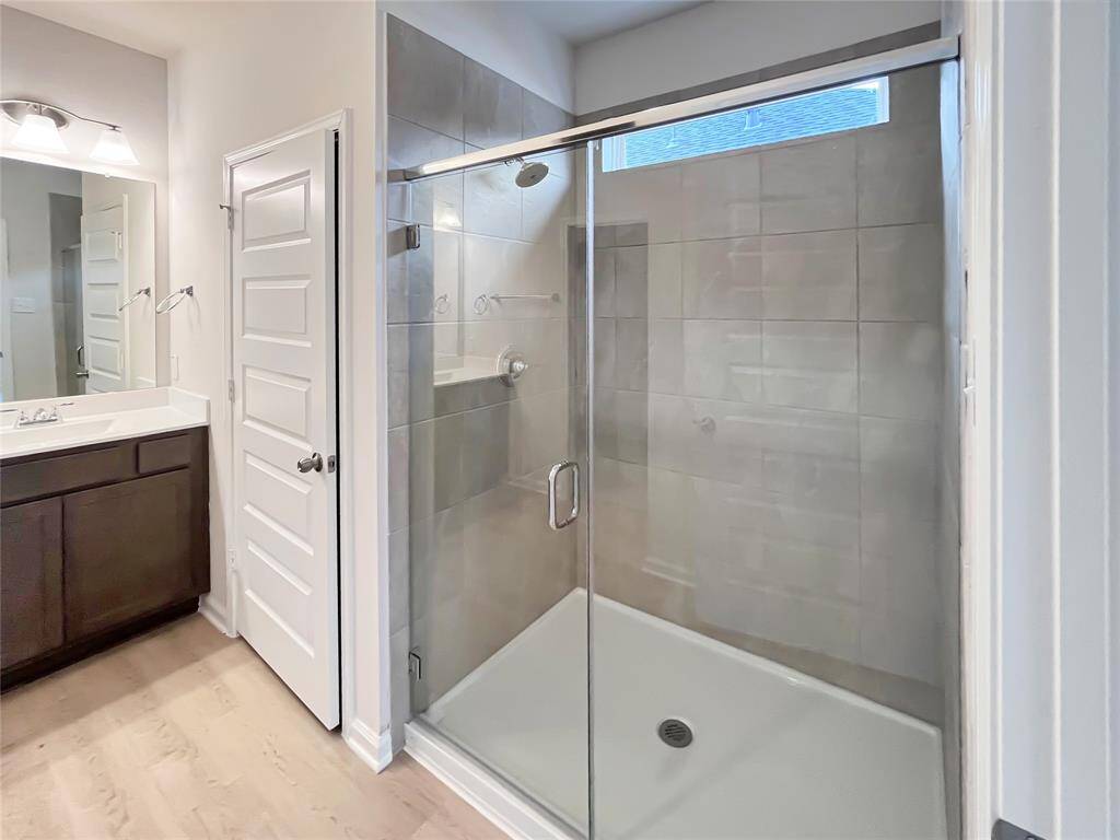 The Cardinal II- Primary Bathroom with Large walk-in Shower. Home under construction. Sample floor plan photo used for illustrative purposes only. Upgrades, selections options, windows and colors may vary.