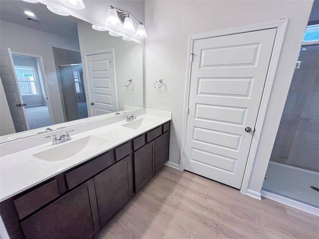 The Cardinal II- Primary Bathroom with Dual Vanities. Home under construction. Sample floor plan photo used for illustrative purposes only. Upgrades, selections options, windows and colors may vary.