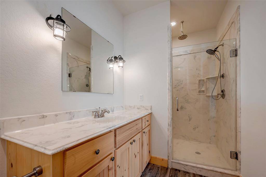 Full ensuite bathroom with walk-in shower for bedroom # 1.