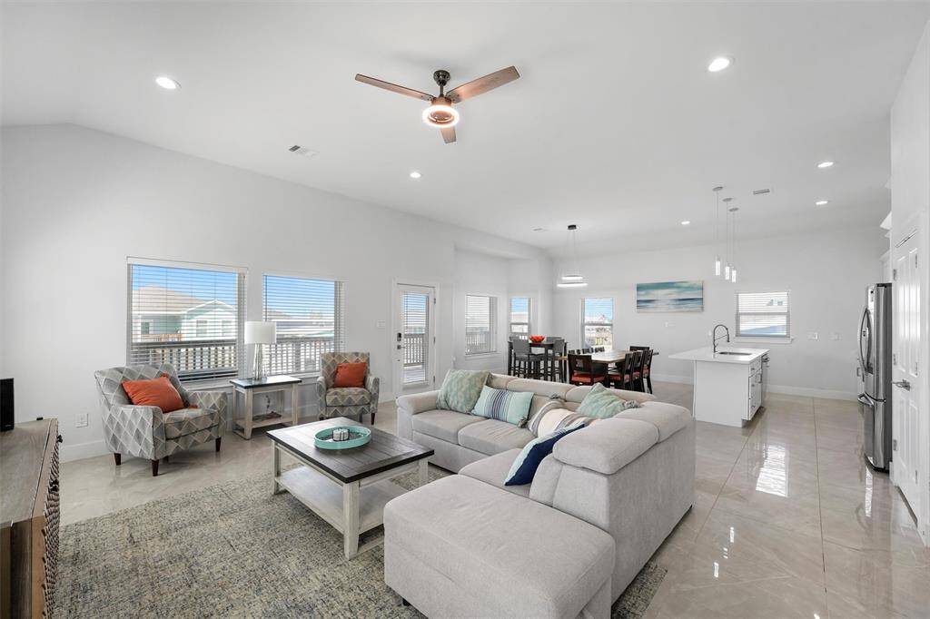 With high ceilings, abundant natural light, and an open layout, this coastal retreat offers a relaxing and inviting atmosphere.