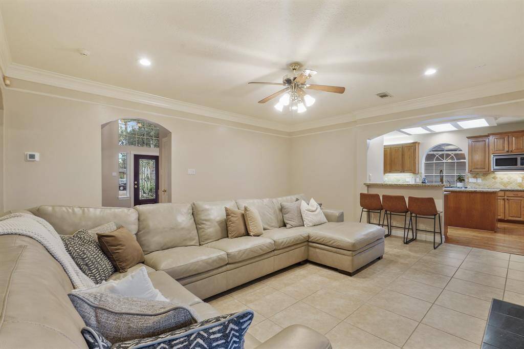 This living room is an entertainer's dream! Direct access to the kitchen where you can be cooking for family and friends all while still being in the center of all of the action!