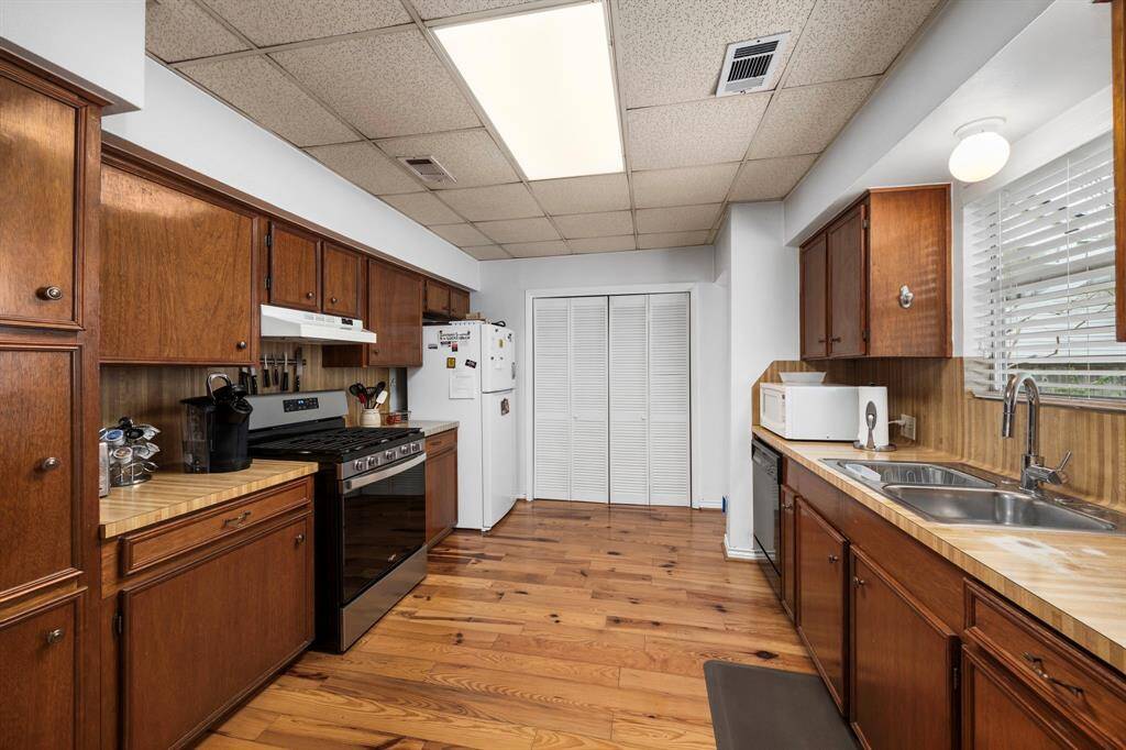 All appliances in the kitchen are fully operational. The utility room is behind the closet doors.