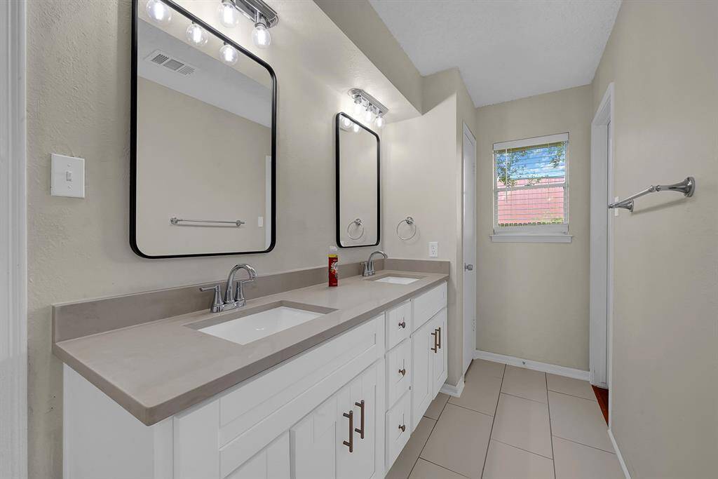 His and her sinks with modern and neutral finishes .
