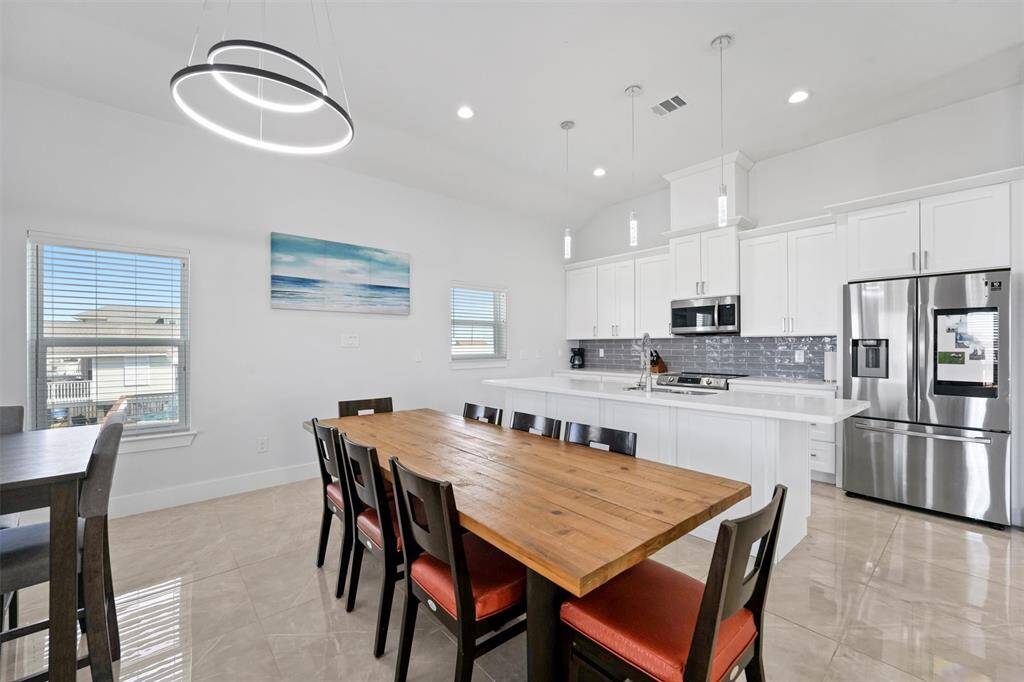 This dining space offers flexibility for entertaining with room for two tables to accommodate large gatherings. Prefer a more open layout? Remove the extra seating to create a more spacious and airy feel.