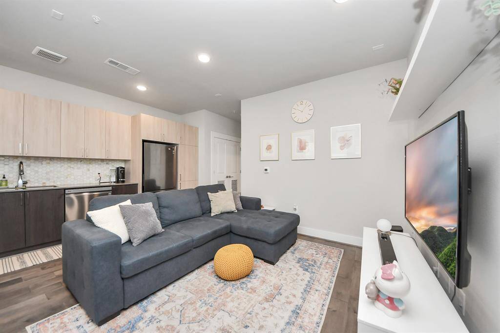 This photo showcases a modern living area with an open-concept design.