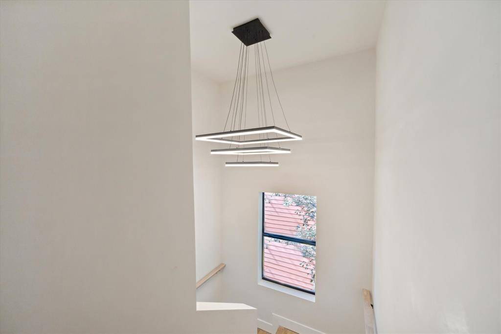 Natural light floods in from all directions, while avant garde light fixtures do double time as art.