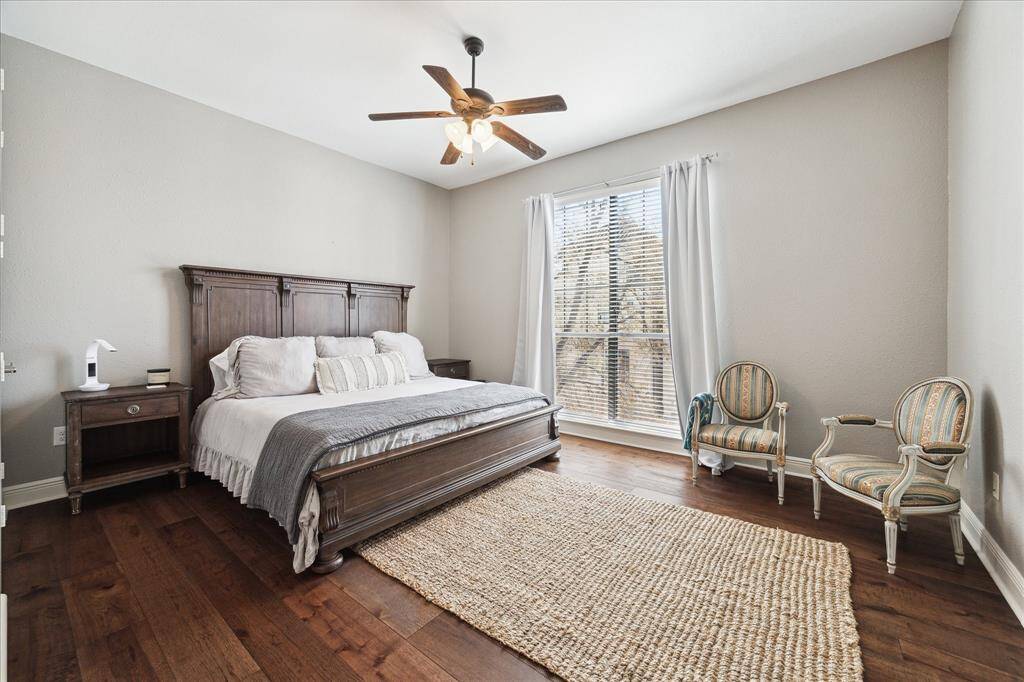 The spacious secondary bedroom features high ceilings, abundant natural light, walk in closet, and access to an en suite bath.