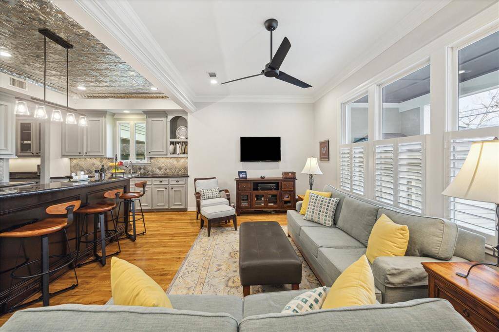 Here’s another view of the den, just off the kitchen—a great spot for conversation, featuring an open layout that invites easy interaction and creates a cozy, welcoming atmosphere.