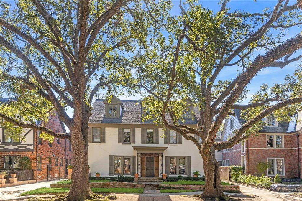 Stunning Old World charmer in Boulevard Oaks has three separate units plus a detached one bedroom garage apartment.