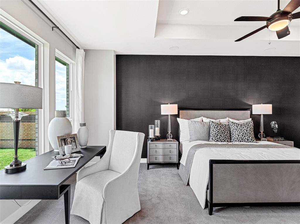 Spacious primary suite features great natural light and room for oversized furnishings.