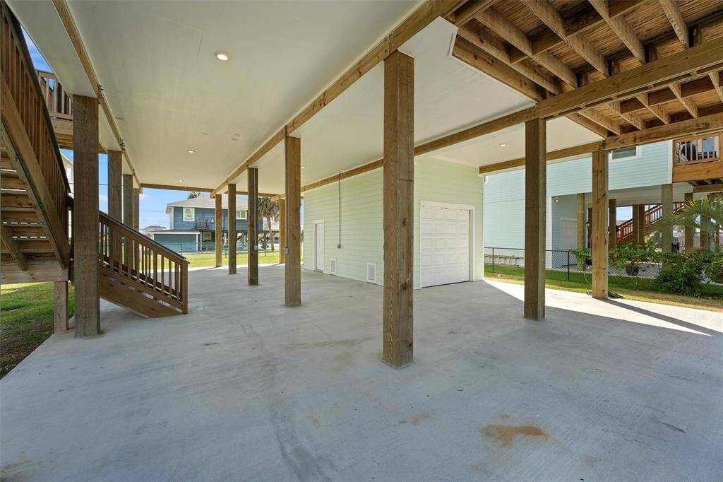 A welcoming entry with plenty of covered space for parking, entertaining, and enjoying the coastal breeze.