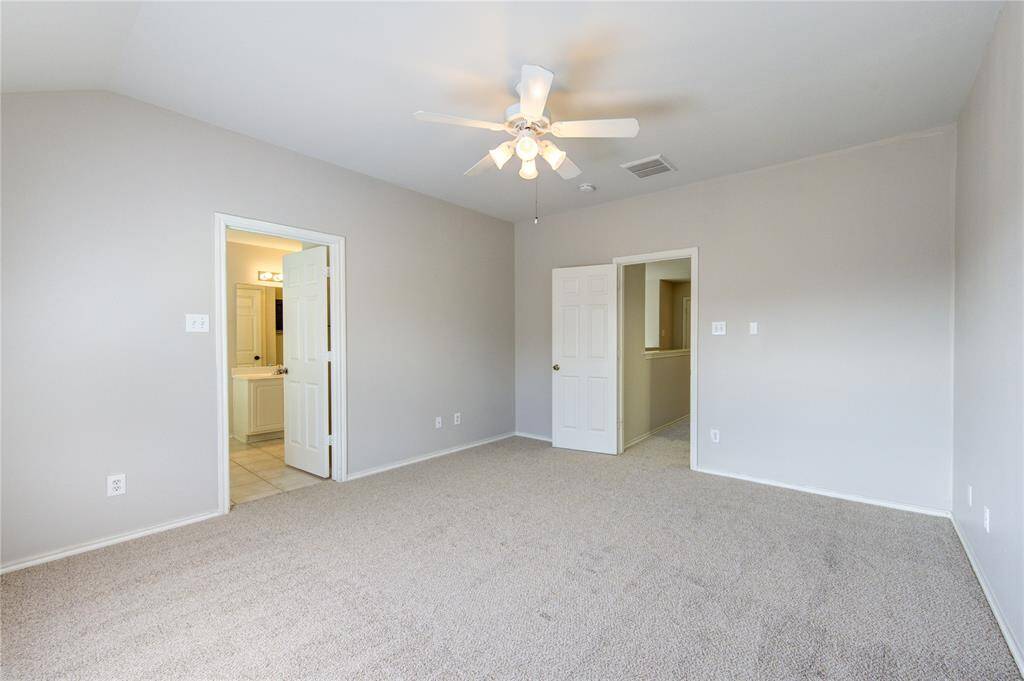 Primary bedroom is spacious and comfortable.