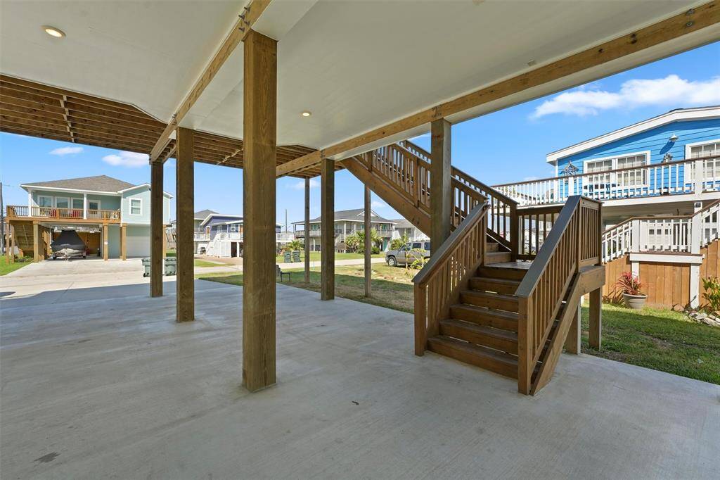 A welcoming entry with plenty of covered space for parking, entertaining, and enjoying the coastal breeze.