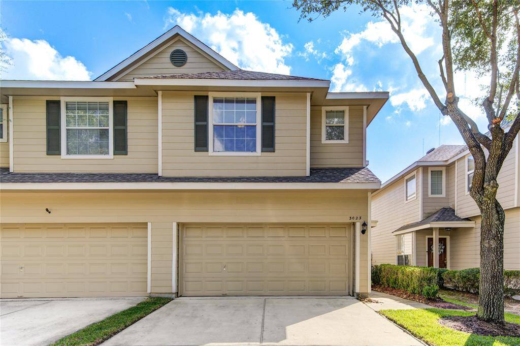 2 car garage with wide driveway.