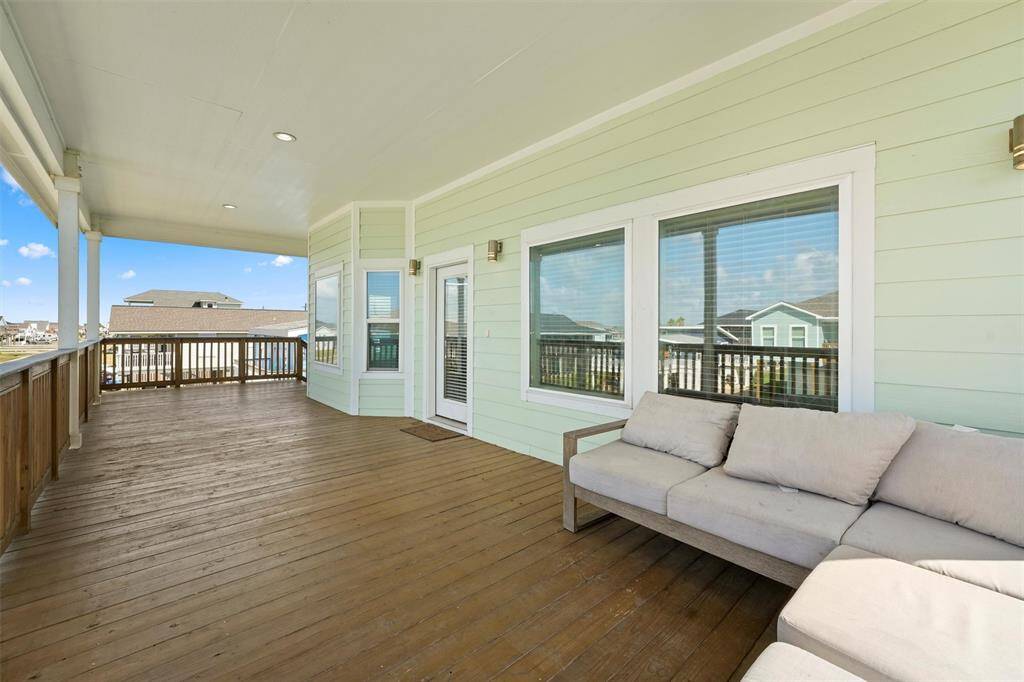This spacious covered deck is perfect for relaxing and enjoying the coastal breeze. Whether you're sipping coffee in the morning or unwinding in the evening, this outdoor space offers the perfect spot to take in the peaceful surroundings.