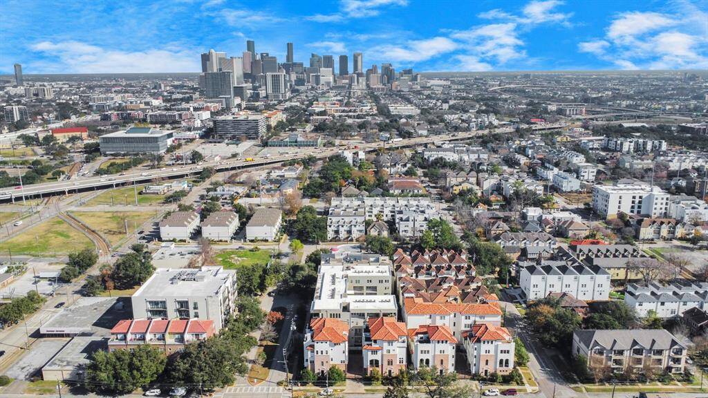 An aerial photograph captures the building while showcasing its prime location just minutes from downtown. Enjoy the perfect blend of urban convenience and a well-designed living space.