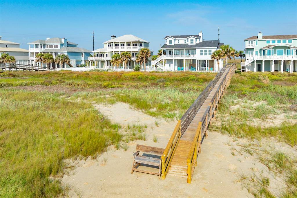View of the home from the beach. Significant vegetation and sand dune structures in place for natural protection from inclement weather & tides.