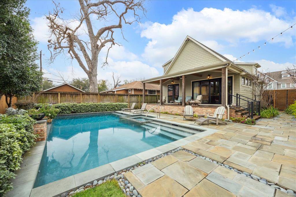 Truly picturesque, the pool house and sparkling pool are beautifully framed by lush landscaping, creating a serene and inviting outdoor oasis.