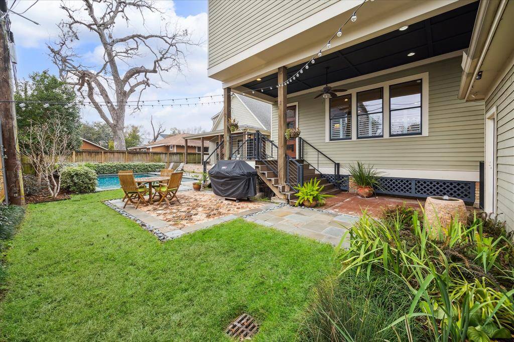 Additional patio areas provide plenty of room for grilling and dining, creating an inviting space for outdoor meals and gatherings with family and friends.
