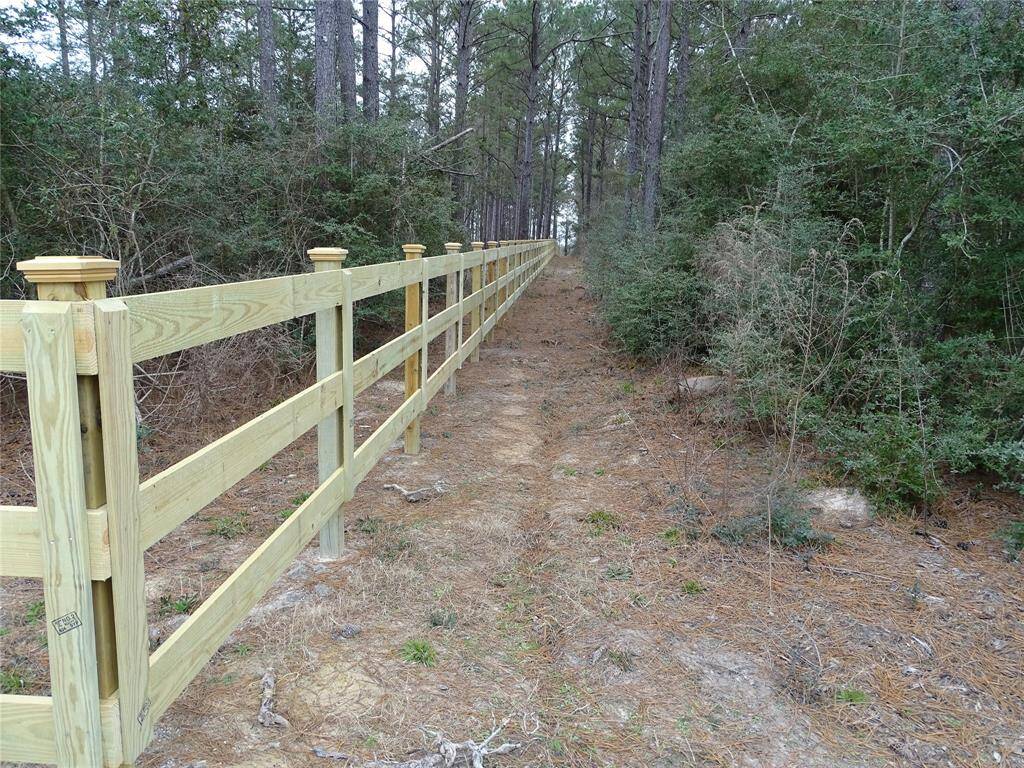 Left side of property is bordered by wooden fence