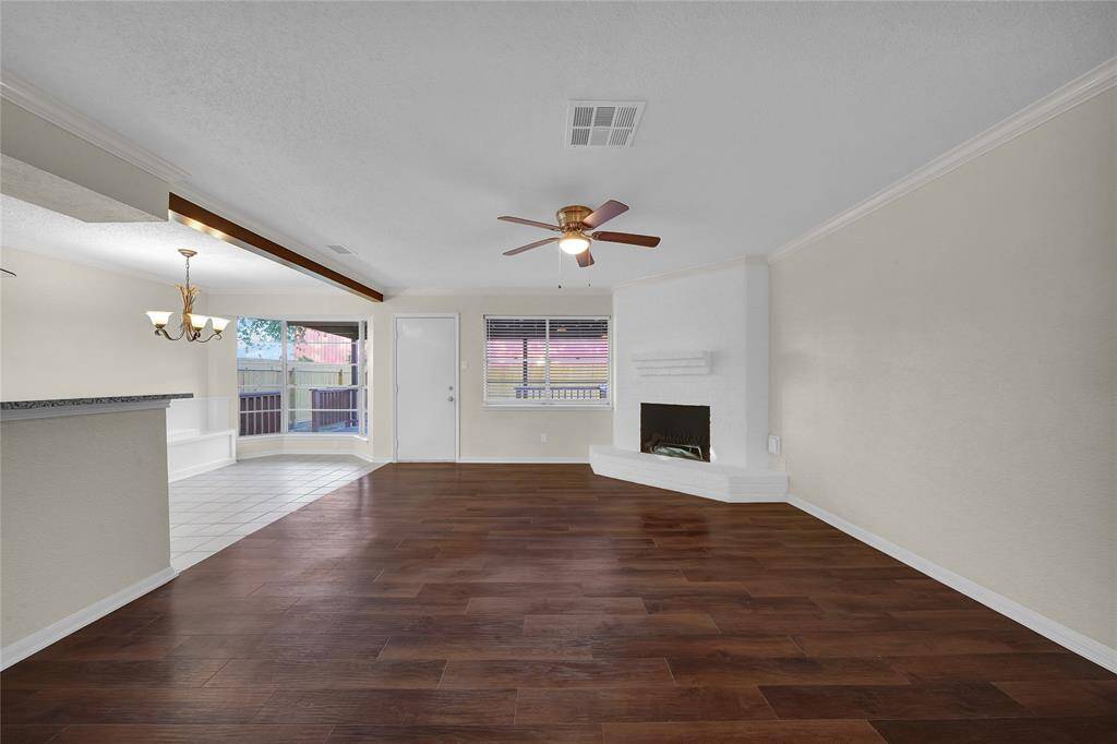 Living room has a gas fireplace