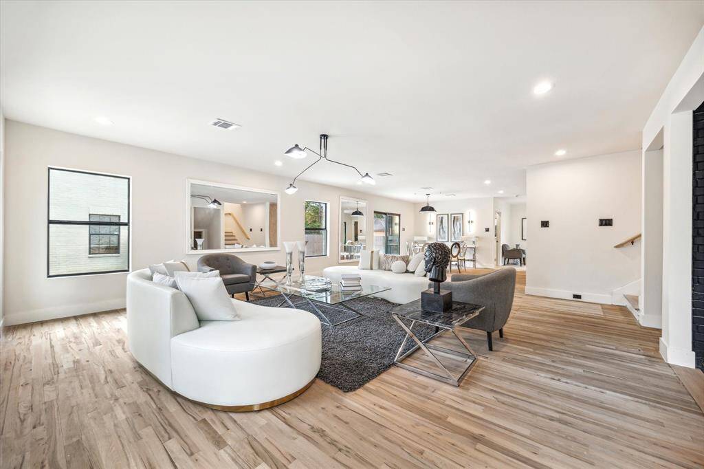 Natural light floods the interior spaces during the day and custom light fixtures and recessed lighting do the work at night.