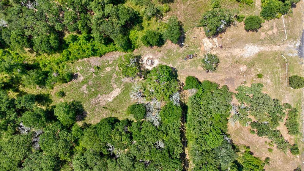 Aerial view of the property with the entry gate to the right.
