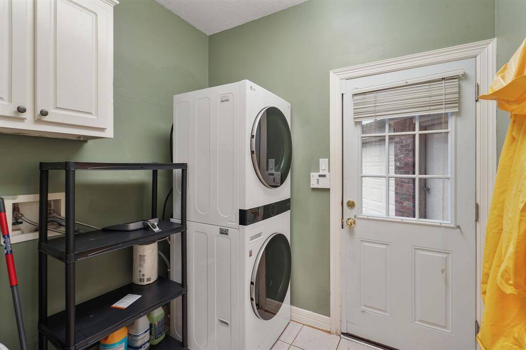 A spacious laundry room on the main floor! Featuring dryer, and washer connections.
