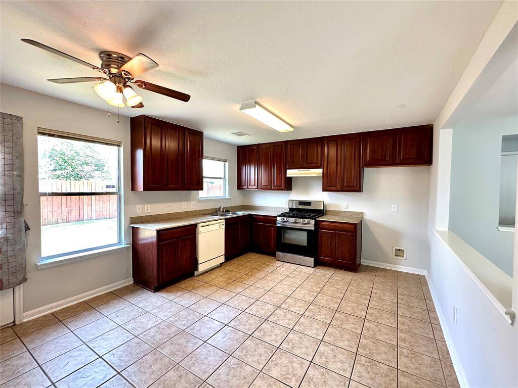 Spacious kitchen with backyard access