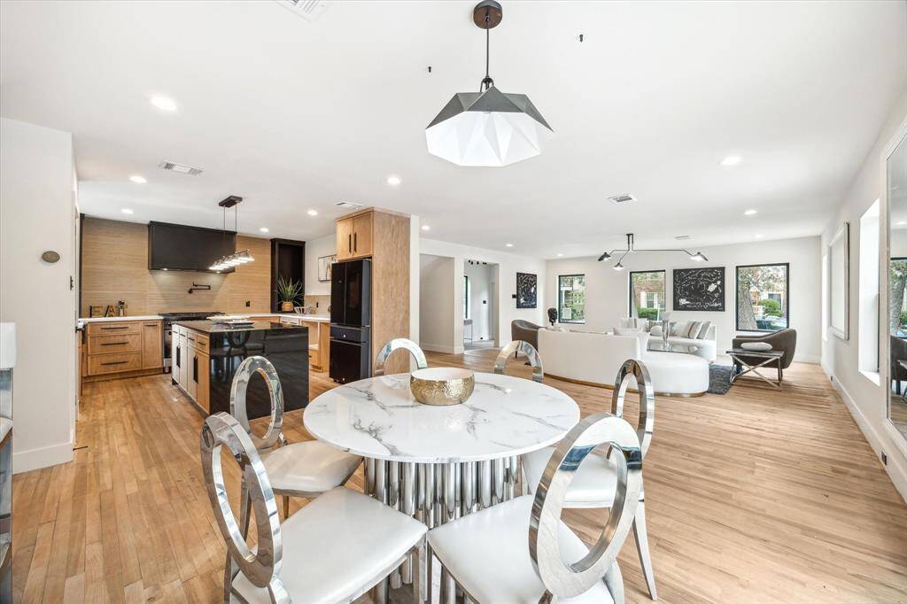 The kitchen merges with the dining room and living room seemlessly.