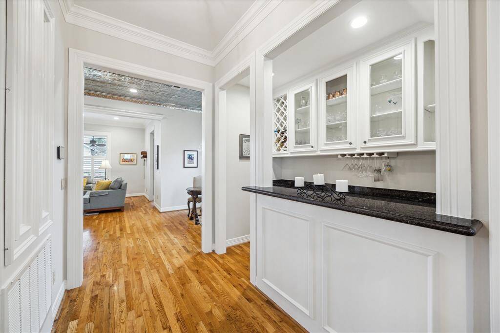 Here’s another view of this gorgeous wet bar, enhanced by elegant crown molding, creating a refined and stylish focal point in the room.