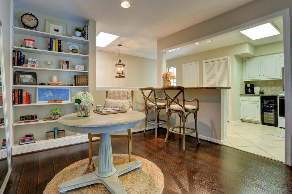 The secondary bedroom features wood flooring, neutral walls, and a decent sized closet.