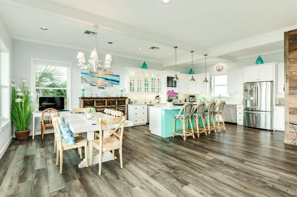 From the living area, you can always be 'in touch' with the groups of friends & family in the kitchen and dining area should you wish.
