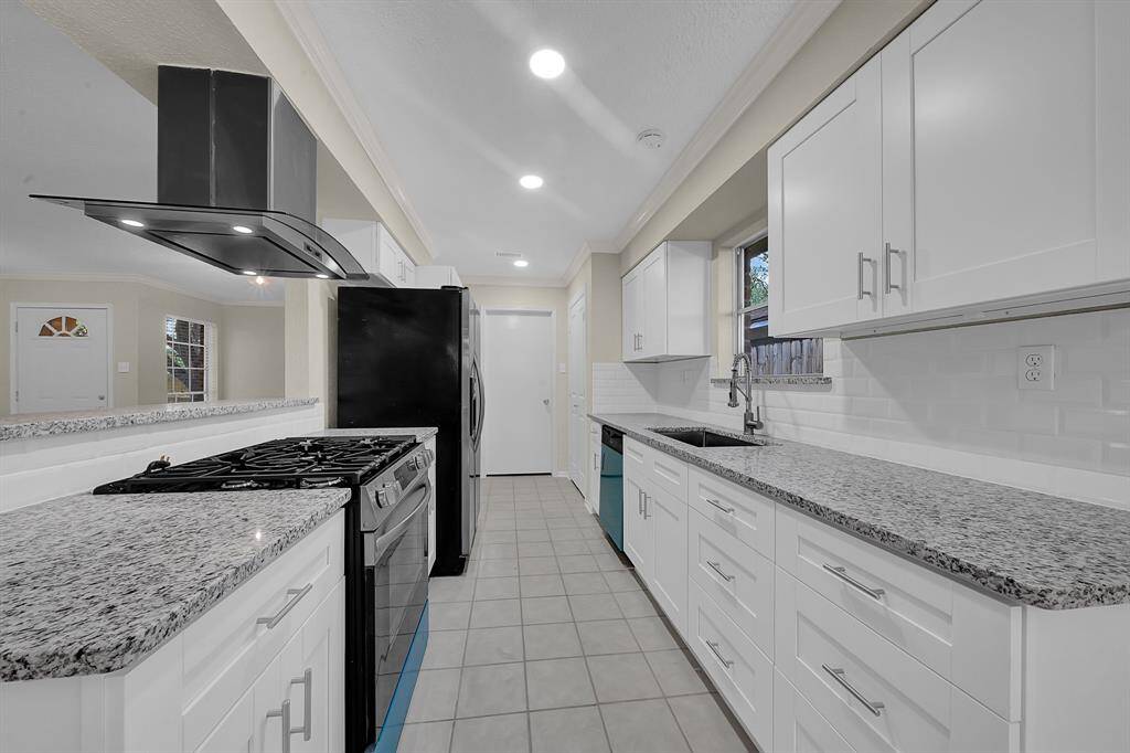 Remodeled kitchen features new cabinets & countertops