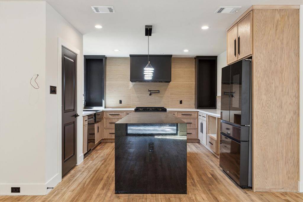 The color palate of the kitchen mirrors those found in nature.