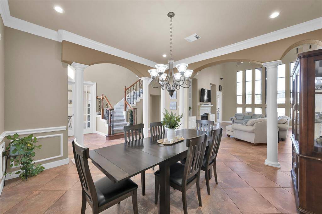 Formal dining connected to kitchen and open to the living area