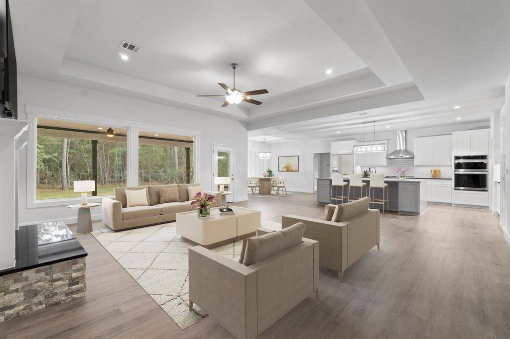 Light and bright with an open concept. The kitchen is open to the living room and dining. Great floor plan.