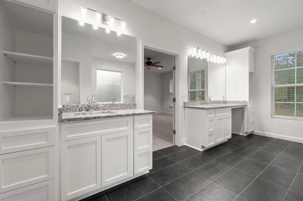 Double sinks in the master bathroom, with lots of storage space, soaking tub, and separate shower!