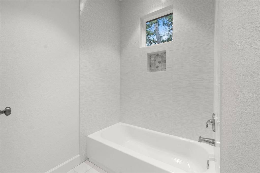Shower tub combo in the secondary bath.