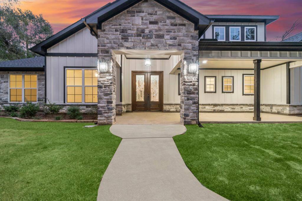 Beautiful stone accents really make this home stand out. Gorgeous, solid wood, double front doors with elegant design.