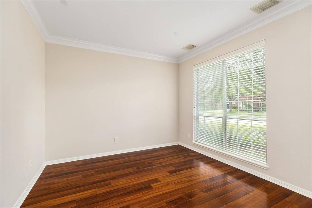 Across from the dining room you'll find the Formal Living Room, which would also make a great office