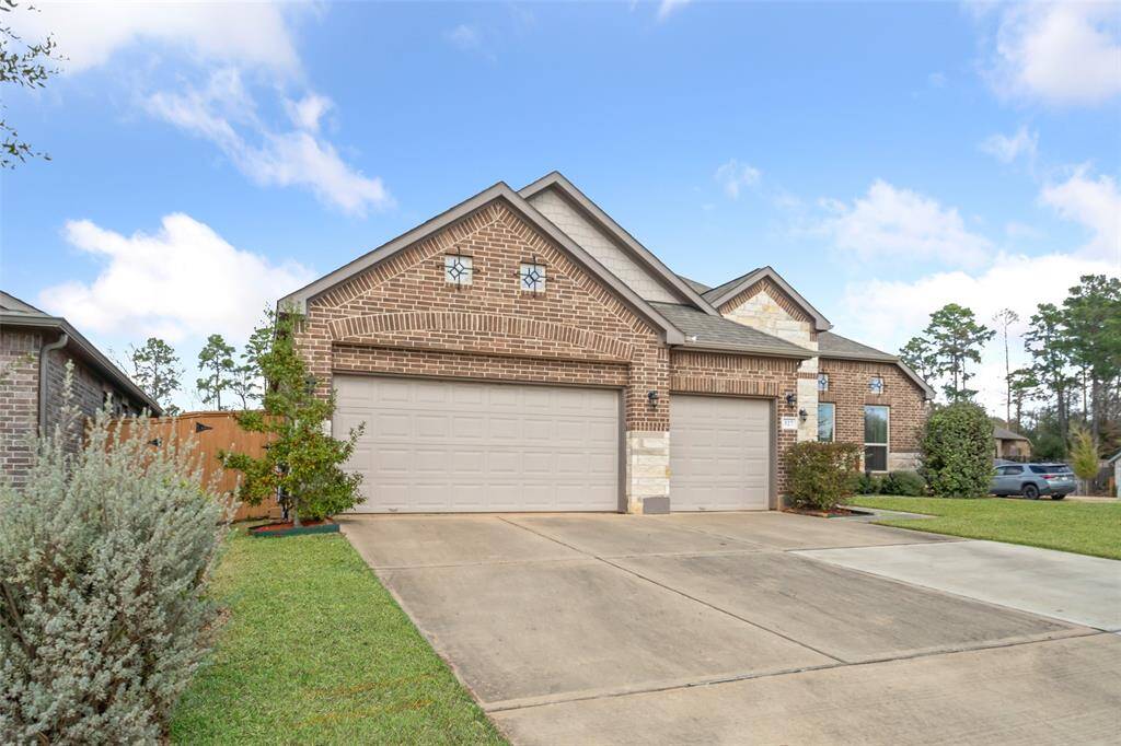 Rare three car garage with expanded driveway