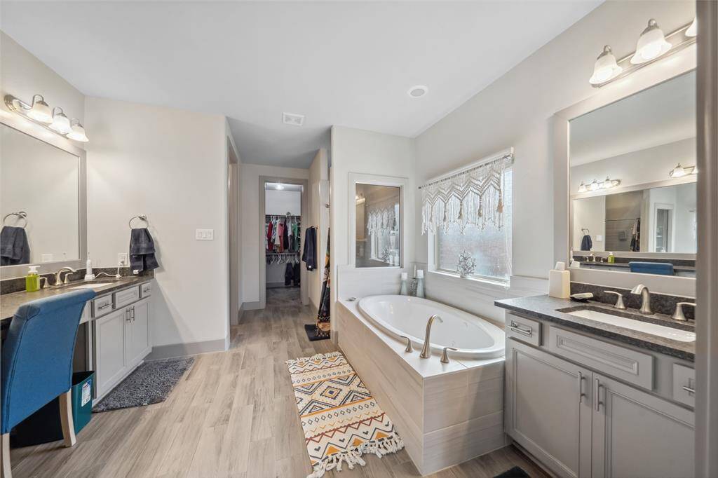 Primary bath has double vanities