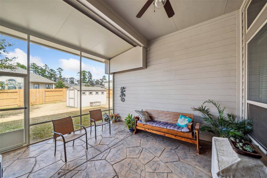 Fully Screened in porch with beautiful stamp concrete.