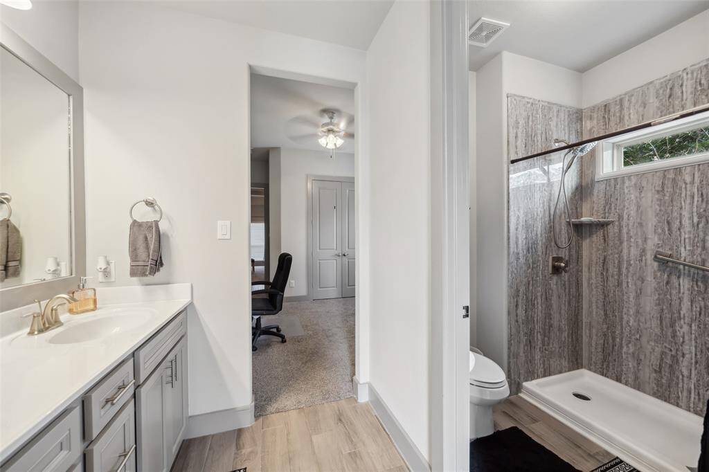 Upgraded walk in shower. The tankless hot water heater with recirculating unit for quick and endless hot water!